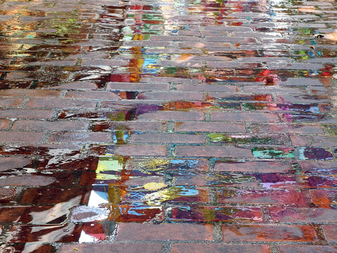 wet asphalt road with puddle in the city