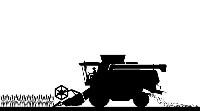A black silhouette of a combine harvester working in a wheat field.