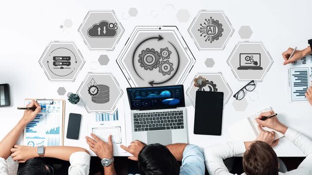 Business Team Collaboration on Technology Development with Graphics and Data on Laptop in Modern Office Setting Sigmoid