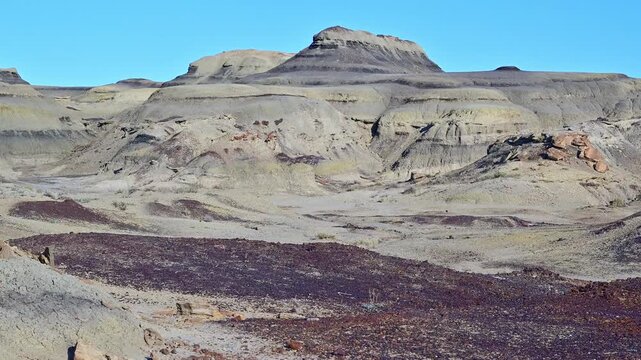 landscape features the unique geological formations of the Bisti De-Na-Zin Wilderness Area in New Mexico