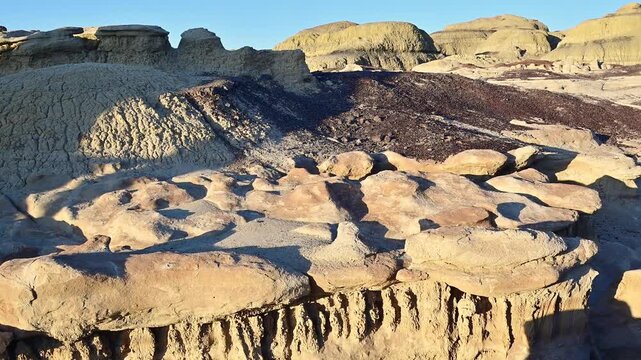 This landscape features the unique geological formations of the Bisti De-Na-Zin Wilderness Area in New Mexico.