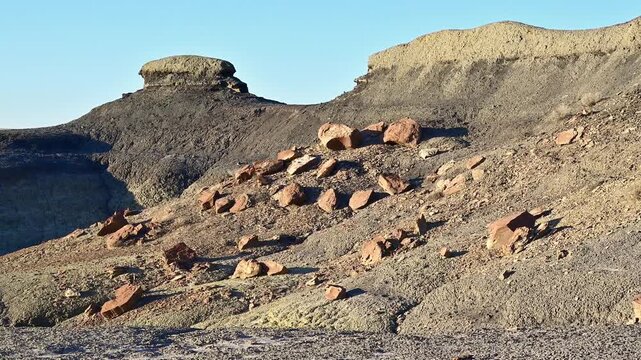 This landscape features the unique geological formations of the Bisti De-Na-Zin Wilderness Area in New Mexico.