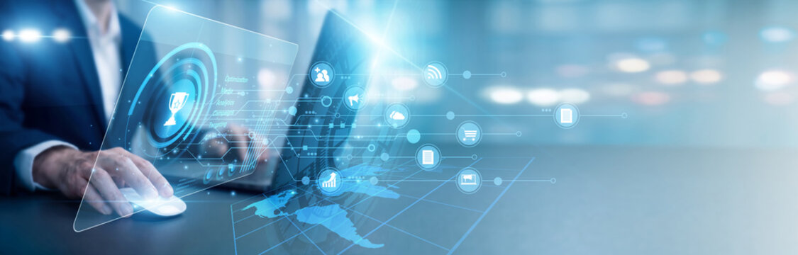 Media buyer using laptop optimizing AdTech tools on a virtual screen with conversion graphs. A world map tracks ad spend. Managing digital advertising technology for targeted brand growth.