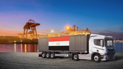 Egyptian Flag on Container Truck in Port: A modern container truck, adorned with the Egyptian flag, stands ready for transport at a bustling port. © bao