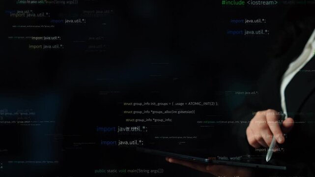 Close-up of a hand using a tablet with floating lines of code in a dark environment, showcasing the complexity and creativity involved in software development. Xenic