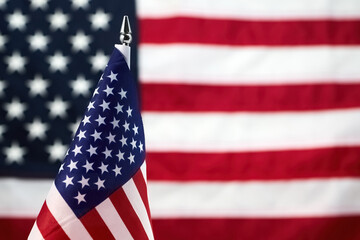 Fototapeta premium American flag desktop miniature with blurred background symbol usa