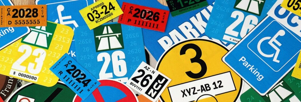 Pattern of traffic and road signs including warning symbols, Swiss and German vignettes