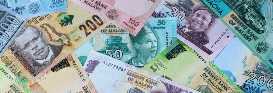 Malawian kwacha money banknotes bunch on table. Malawi bills of MWK currency