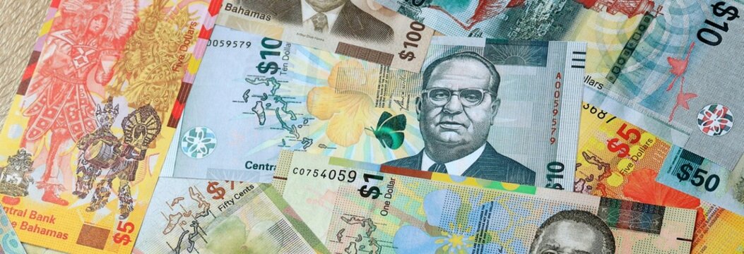 Bahamian dollar money banknotes bunch on table. Bahamas bills of BSD currency close up