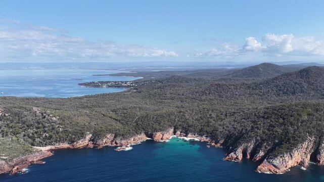 Sleepy bay and beach to Coles bay in Freycinet national park &ndash; aerial landscape view.