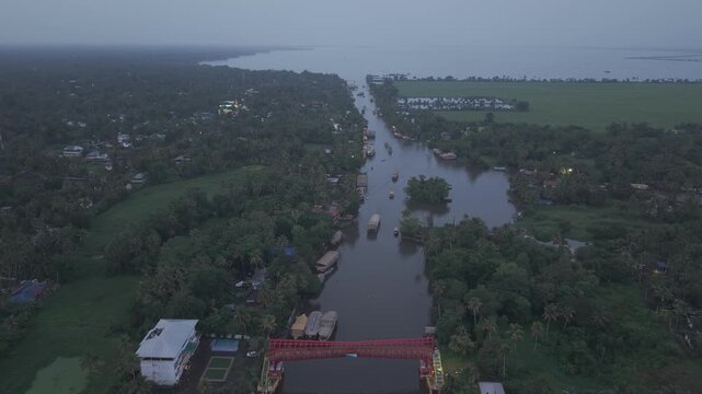 Aerial drone view of traditional houseboats on Kerala backwaters, Alappuzha, India.
