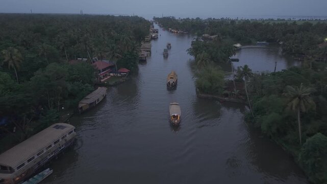 Aerial drone view of traditional houseboats on Kerala backwaters, Alappuzha, India.