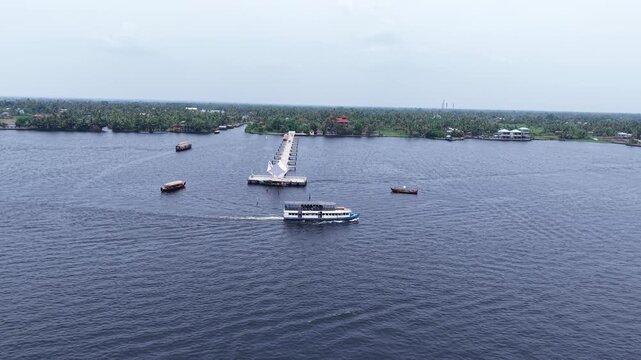 Aerial drone view of traditional houseboats on Kerala backwaters, Alappuzha, India.
