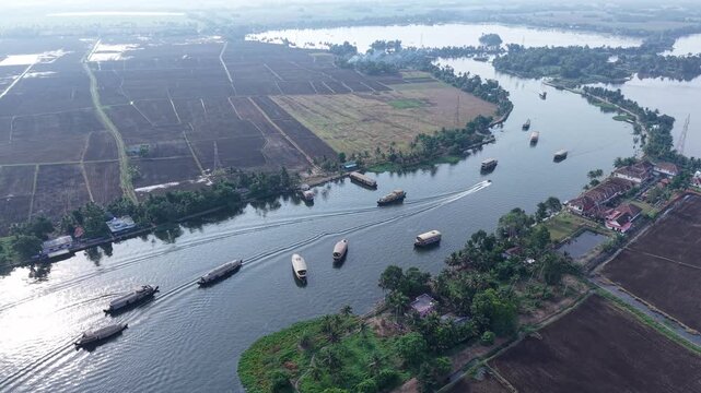 Aerial drone view of traditional houseboats on Kerala backwaters, Alappuzha, India.
