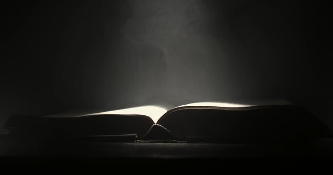 Super Slow Motion Calm Glowing Sacred Text Pages. Tranquil Illuminated Manuscript Leaves Bearing Divine