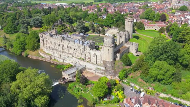 Aerial forward moving view of the medieval 14th century castle in Warwick in the UK