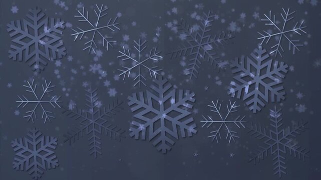Winter background featuring various shapes of falling paper-cut style snowflakes over a dark blue textured night sky.