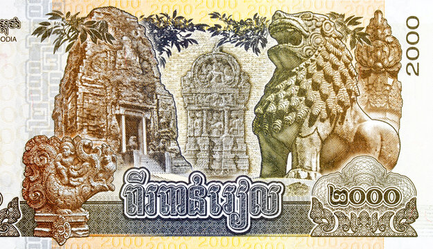 Cambodian 2000 Riel banknote featuring Prasat Pram temple and traditional Singha, stone lion statue. Cambodian paper money.