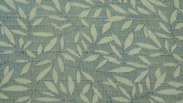 Light green leaf patterned fabric, nature style.