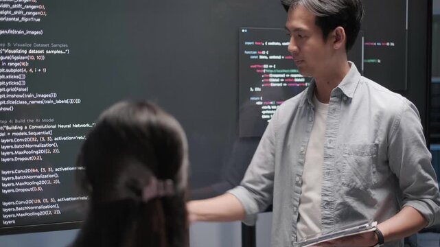 Programmer software developer engineer coding project presentation monitor meeting working data analysis business information technology tech support database concept
