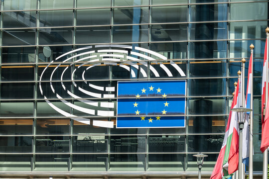 22 May 2026, Brussels, Belgium. European Parliament emblem and EU flag on glass facade