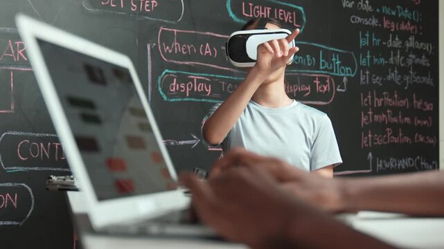 Closeup of african student hands coding or programming system at blackboard with web develop plan while young girl playing in metaworld at blackboard with engineering prompt. Innovation. Edification