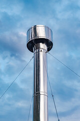 Fototapeta premium metal round chimney at sky background