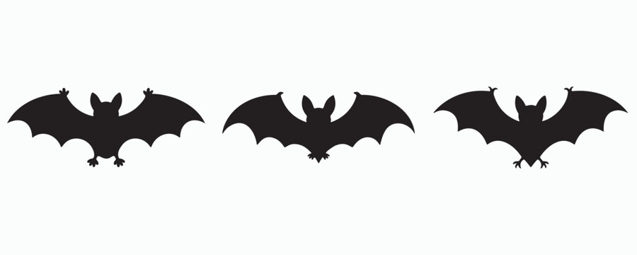 Three black bat silhouettes with spread wings isolated on a light gray background. Minimal flat flying animal icons representing Halloween, night creatures, wildlife, and spooky decorative design.