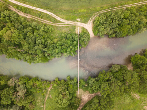 Aerial view of a suspension bridge over the river. Irati River, Navarre