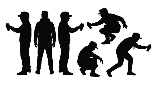Set of silhouettes of a graffiti artist holding a spray paint can