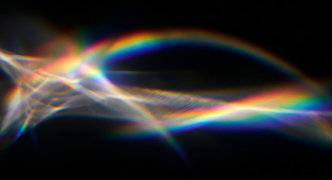 Abstract elegant prism light refraction effect overlay. A beautiful soft rainbow-colored spectrum leak and glowing caustics drifting across the frame. 