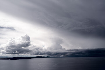 Fototapeta premium View of Lake Titicaca from Amantani Island under stormy clouds