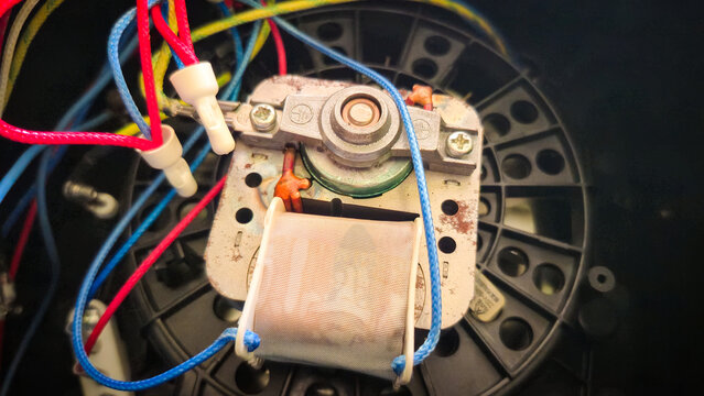 Close‑Up of Electromechanical Component with Wires and Coil