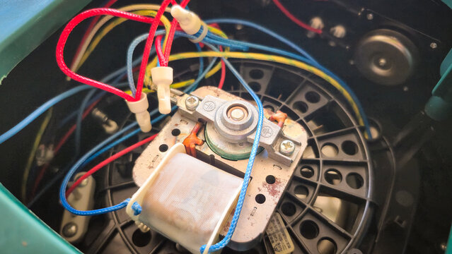 Close‑Up of Electromechanical Component with Wires and Coil