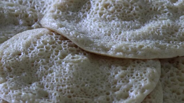 Stack of Baghrir Moroccan honeycomb pancakes close-up macro
