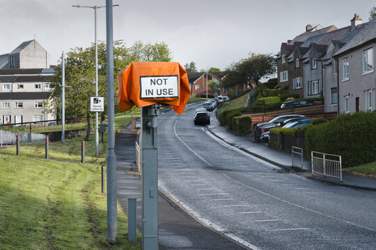 Road safety speed camera with not in use sign cover