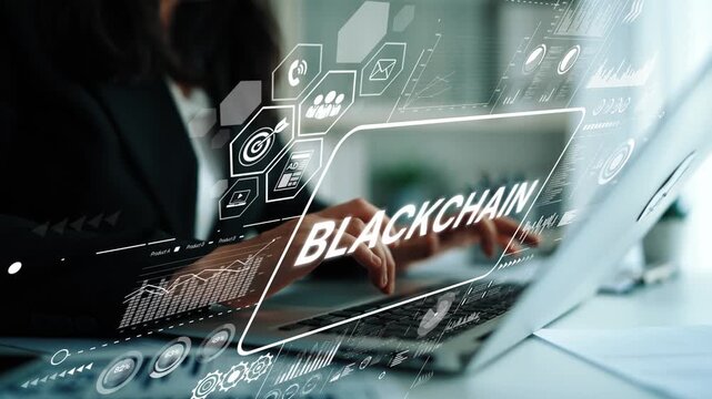 Business professional working on laptop with blockchain technology interface and data visualization in modern office environment. Asymptotic smart data analytic.