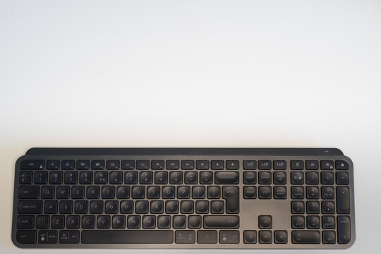 Full-frame wireless mechanical keyboard on white background