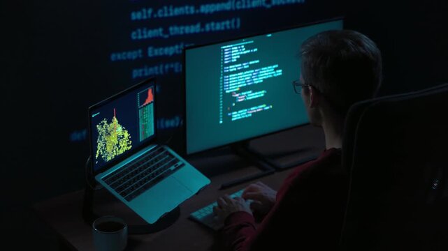 Concentrated male coder works at multi-monitor setup in a dimly lit room with lines of code projected in the background. Software engineer tackles a challenging machine learning script late at night
