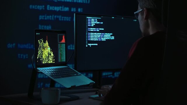 Developer sits in a dimly lit workspace, in front screens displaying code and data science data graph. Focused programmer working, deeply immersed in solving an artificial intelligence problem
