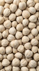 Obraz premium Top View Texture of Whole Raw Candlenuts Background Traditional Asian Spice Food Ingredient