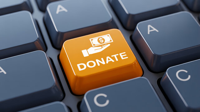 Donate button on computer keyboard for online charity giving