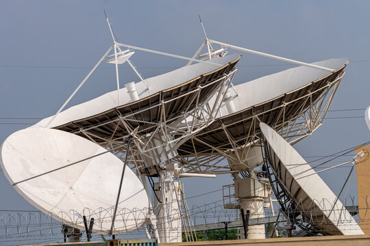 Networking dish antenna, broadcast transmission, large parabolic antenna, IoT connectivity, cloud networking, satellite communication, AI data center, fiber optic network cables, subsea cable network.