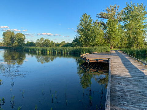 Boardwalk wooden nature path, wetlands marsh water at Glacier Ridge Metro Park Columbus Ohio. Concepts of opportunity, strategy, direction, and decision making.