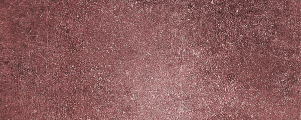 Fototapeta premium A closeup view of a textured red metallic surface with scratches and marks