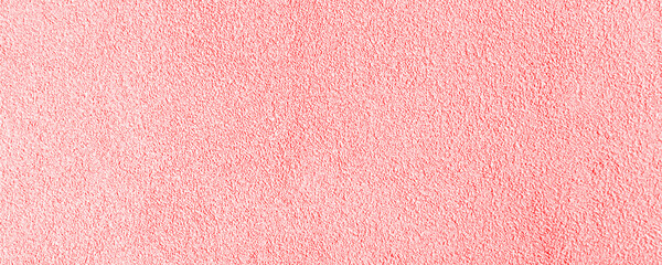 Fototapeta premium Soft pink textured surface with a subtle grainy pattern and a gentle sheen