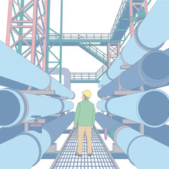 A worker stands on a metal walkway between large industrial pipes in a facility © Aditya