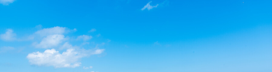Blue sky with few white clouds on a sunny day © Gabriele Maltinti