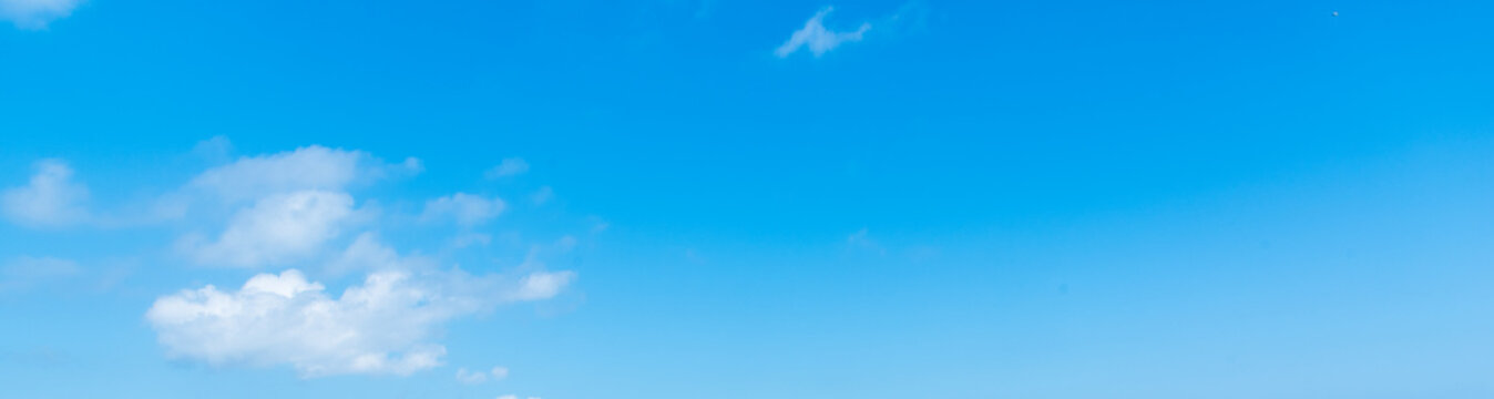 Blue sky with few white clouds on a sunny day