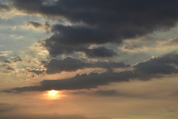 Obraz premium Dark clouds with blue sky during sunset.